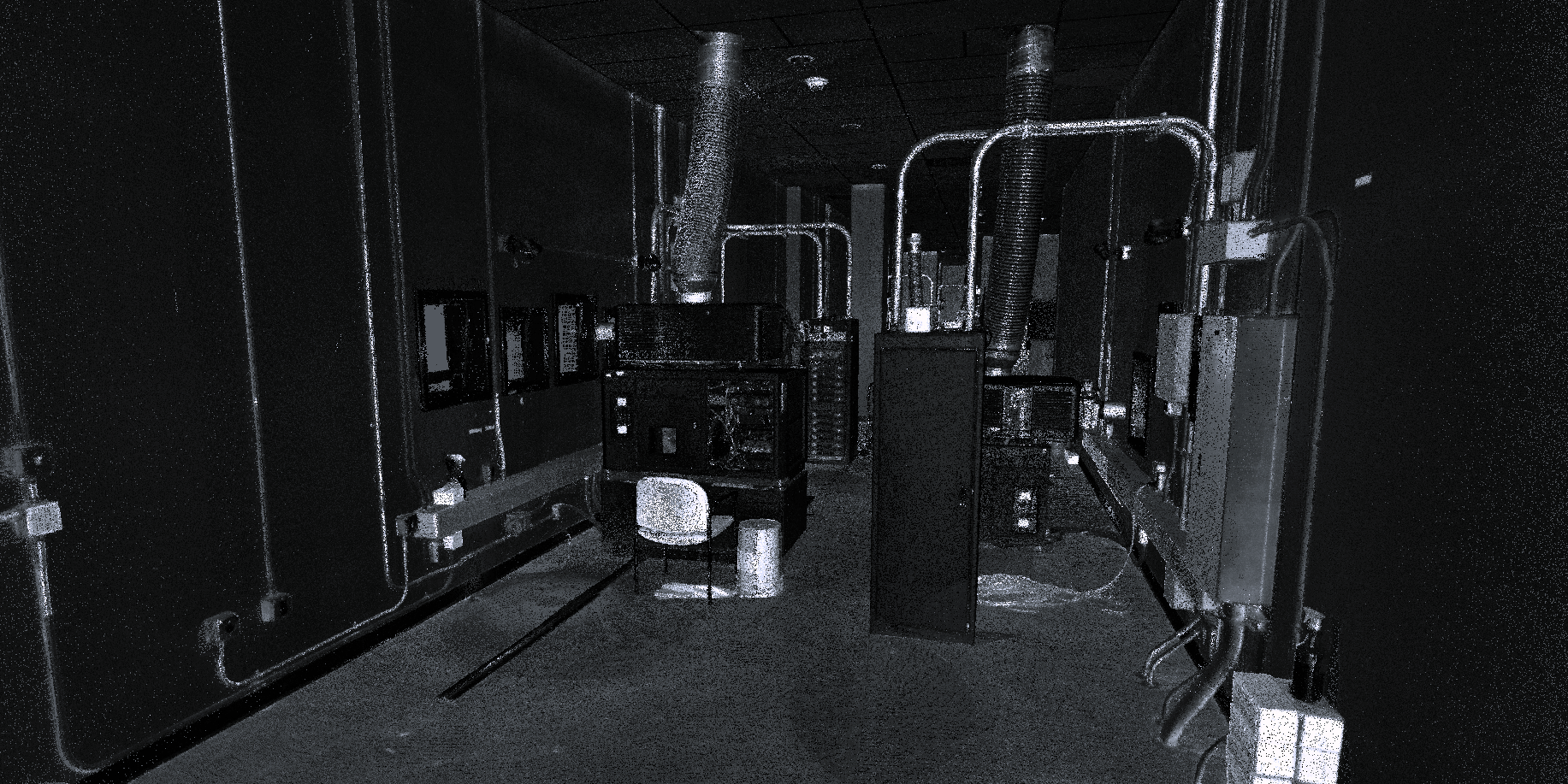 A detailed point cloud of a projection room, capturing the intricate layout of projection equipment, ventilation systems, and electrical elements.