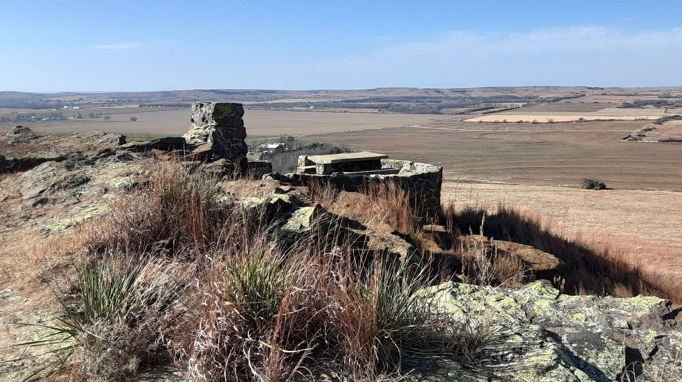 A WPA-era stone picnic site overlooks the rolling Kansas landscape atop Coronado Heights.