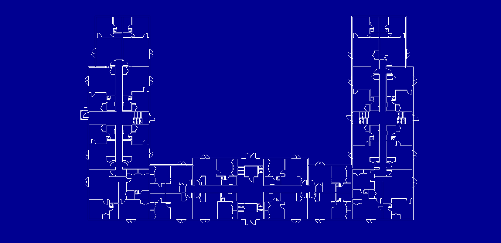 Blueprint-style floor plan of the U-shaped apartment building, with three stairwells and detailed unit divisions.