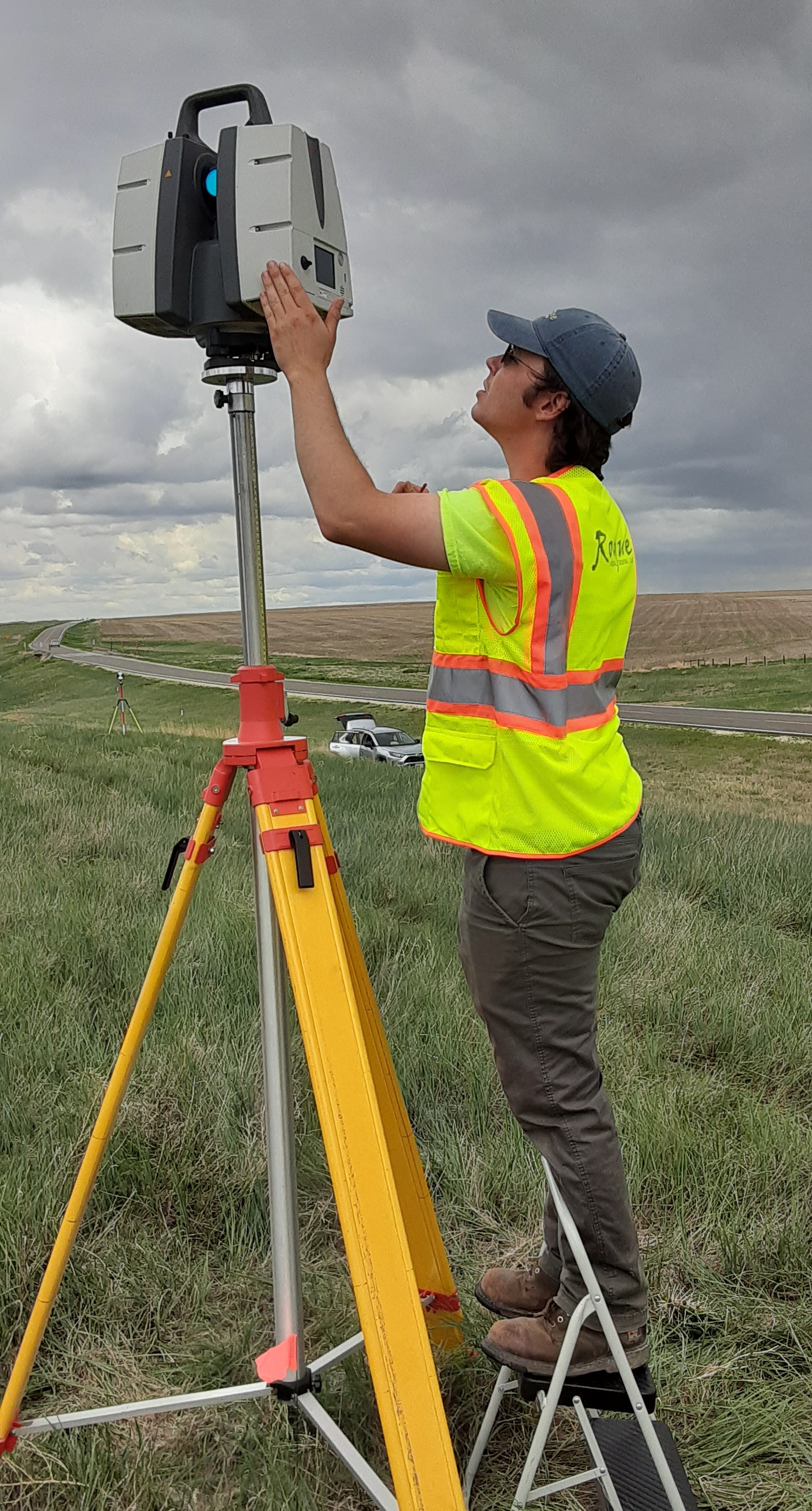A LiDAR specialist prepares the P50 scanner for data collection at the bridge site.