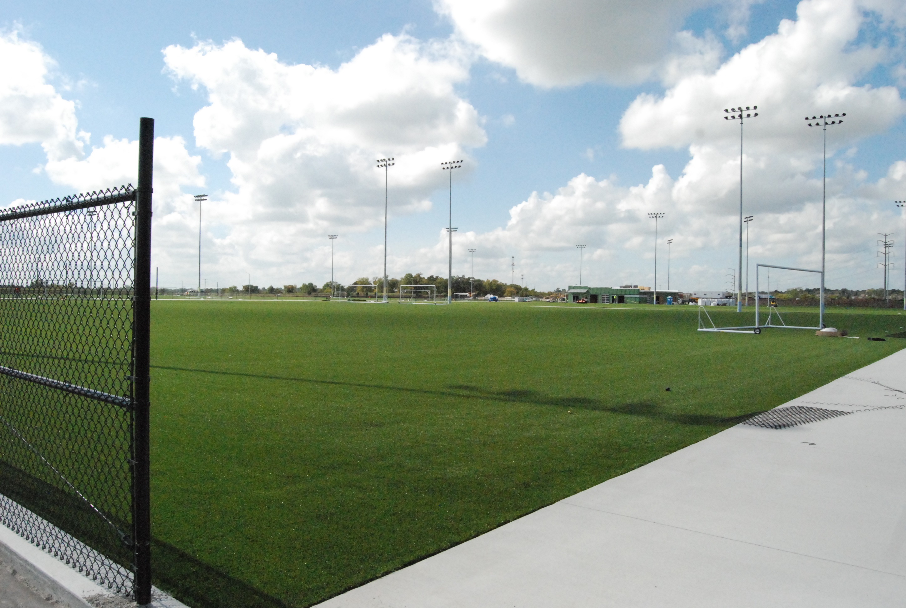 spots field with lighting and green grass
