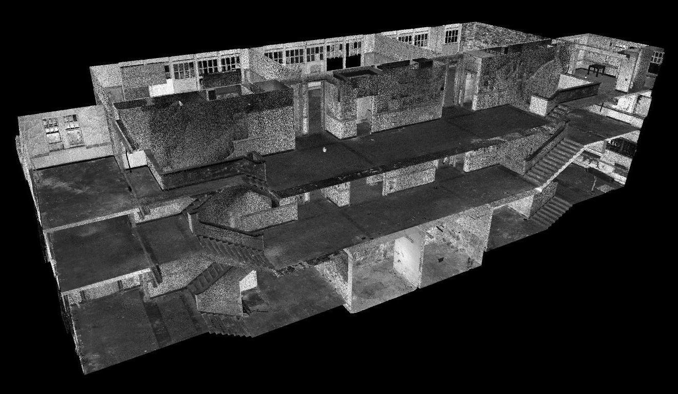 A cutaway LiDAR point cloud of the Old Whittier School. It is cut down the main hallway showing half of the basement, first, and second floors.