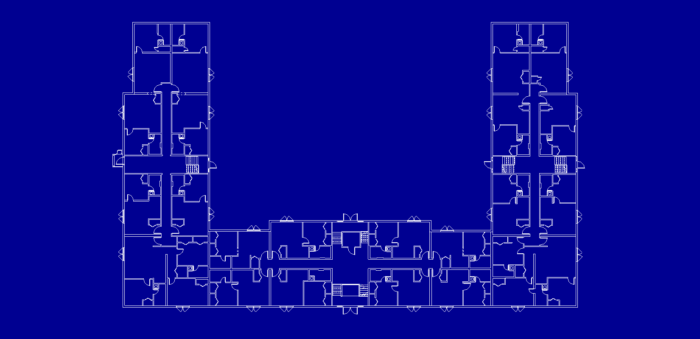Floor plan of an apartment building stylized as a blueprint.  The building is arranged in a "U" shape and has 3 stairwells. 3 main hallways, and numerous apartments. 